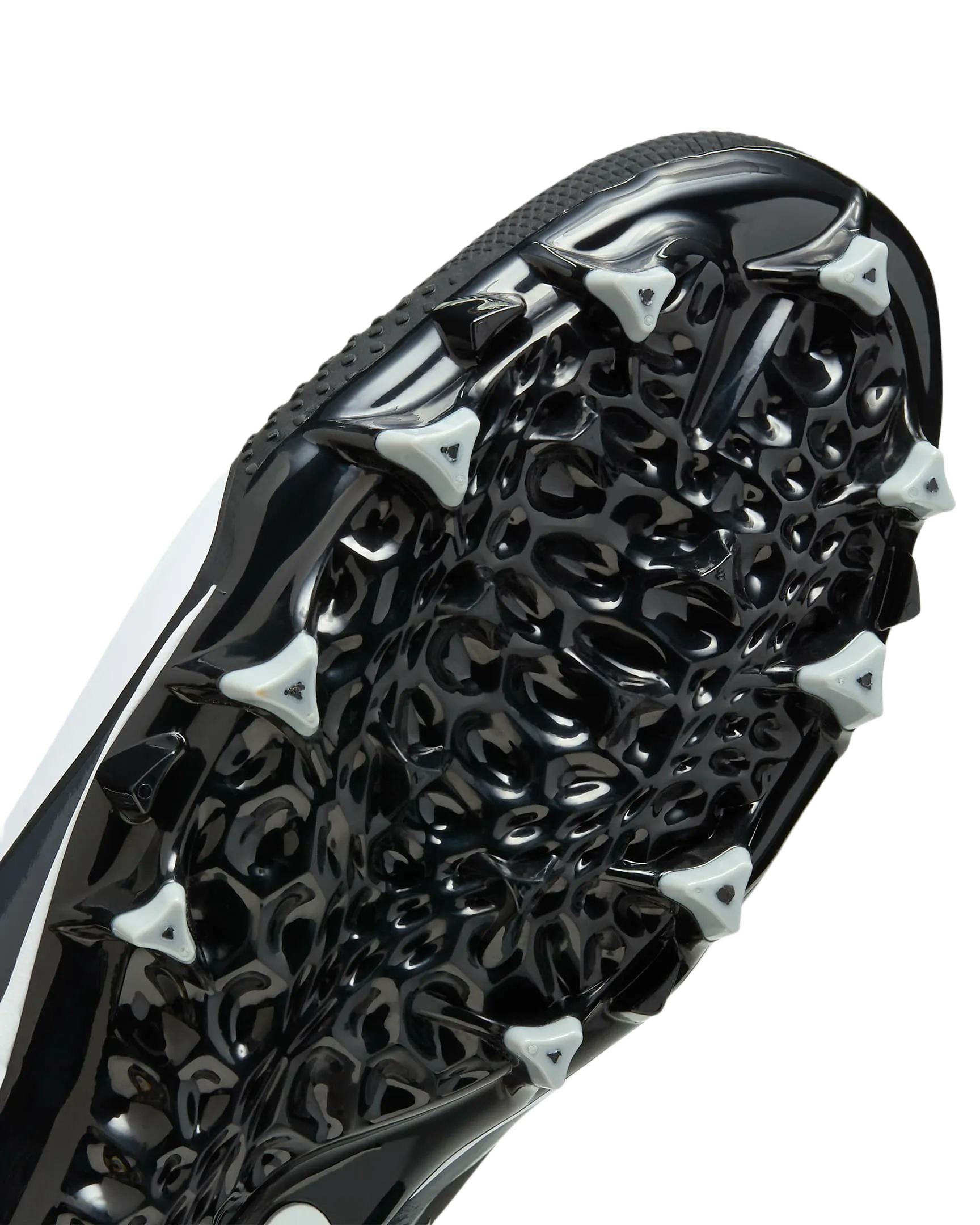 Close-up of Nike Alpha Menace Varsity 4 cleat black and white outsole with triangular cleats for traction